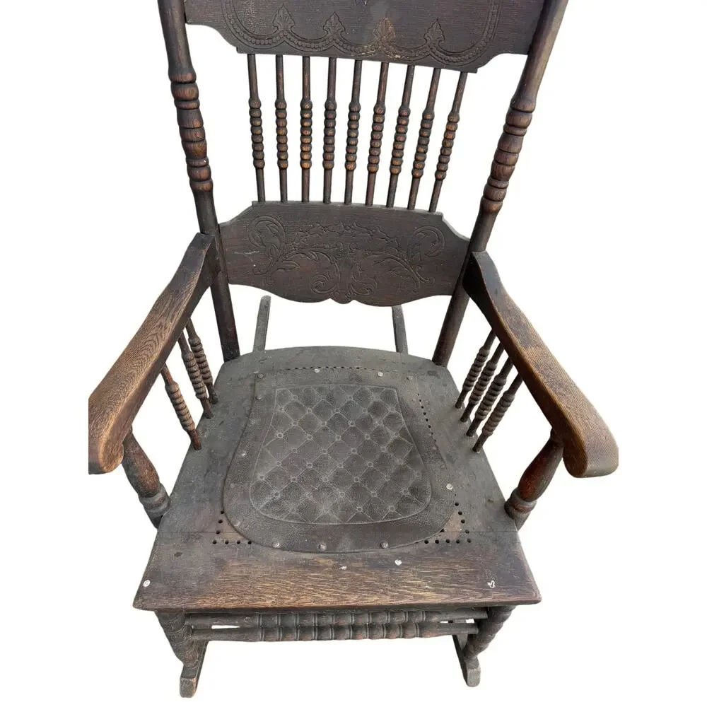 Antique Spindle Rocking Chair With Carvings and Cutout accent